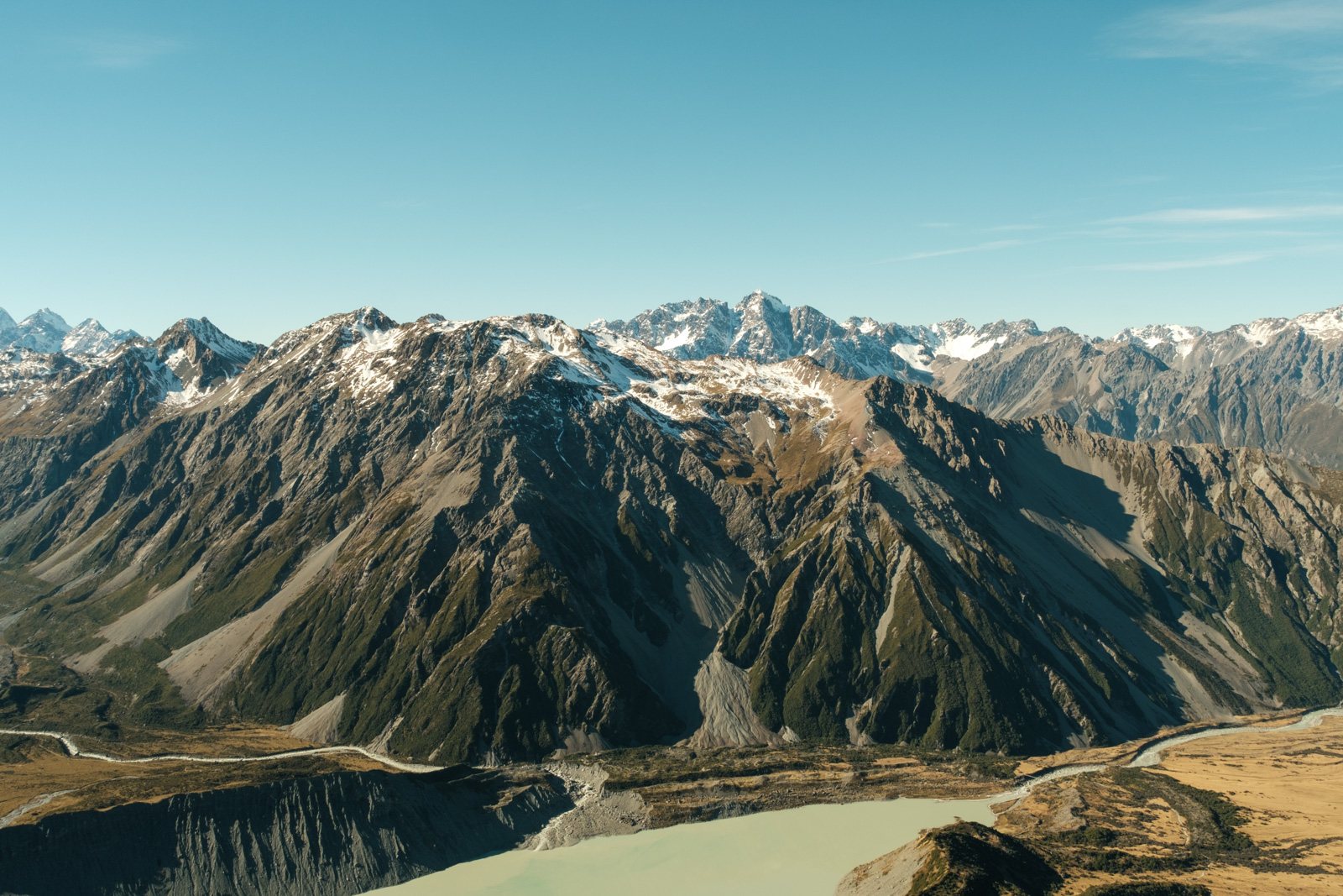 The Main Divide above a braided valley — the Canterbury high country.