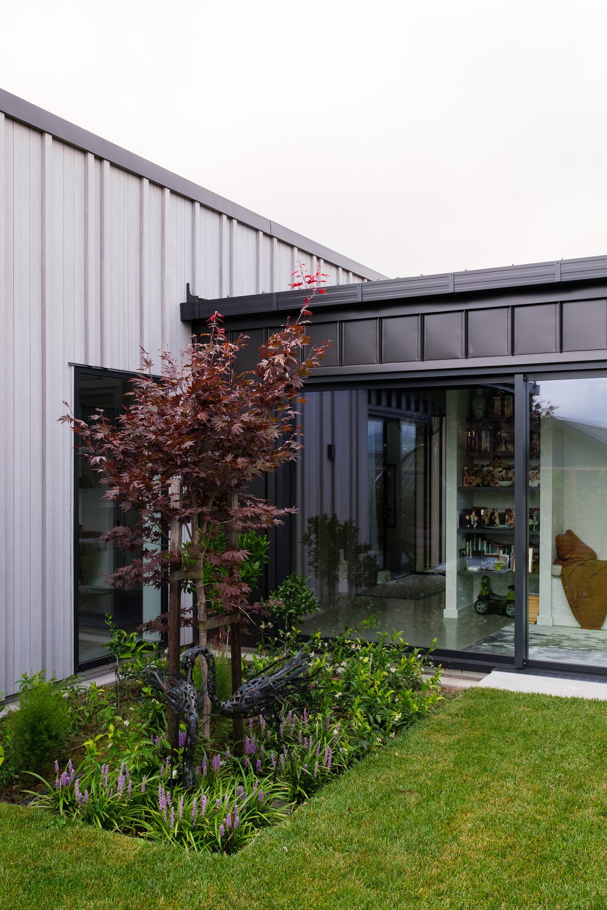 Glazed living opening to the lawn.