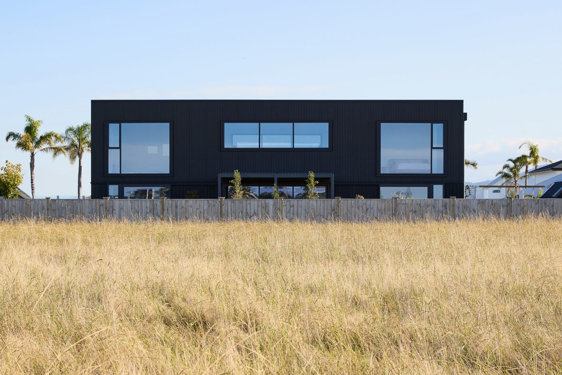 Arrival: the black monolith across the grass reserve.