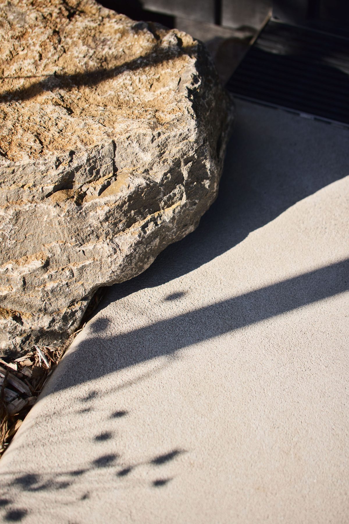 Rock and shadow at the entry.