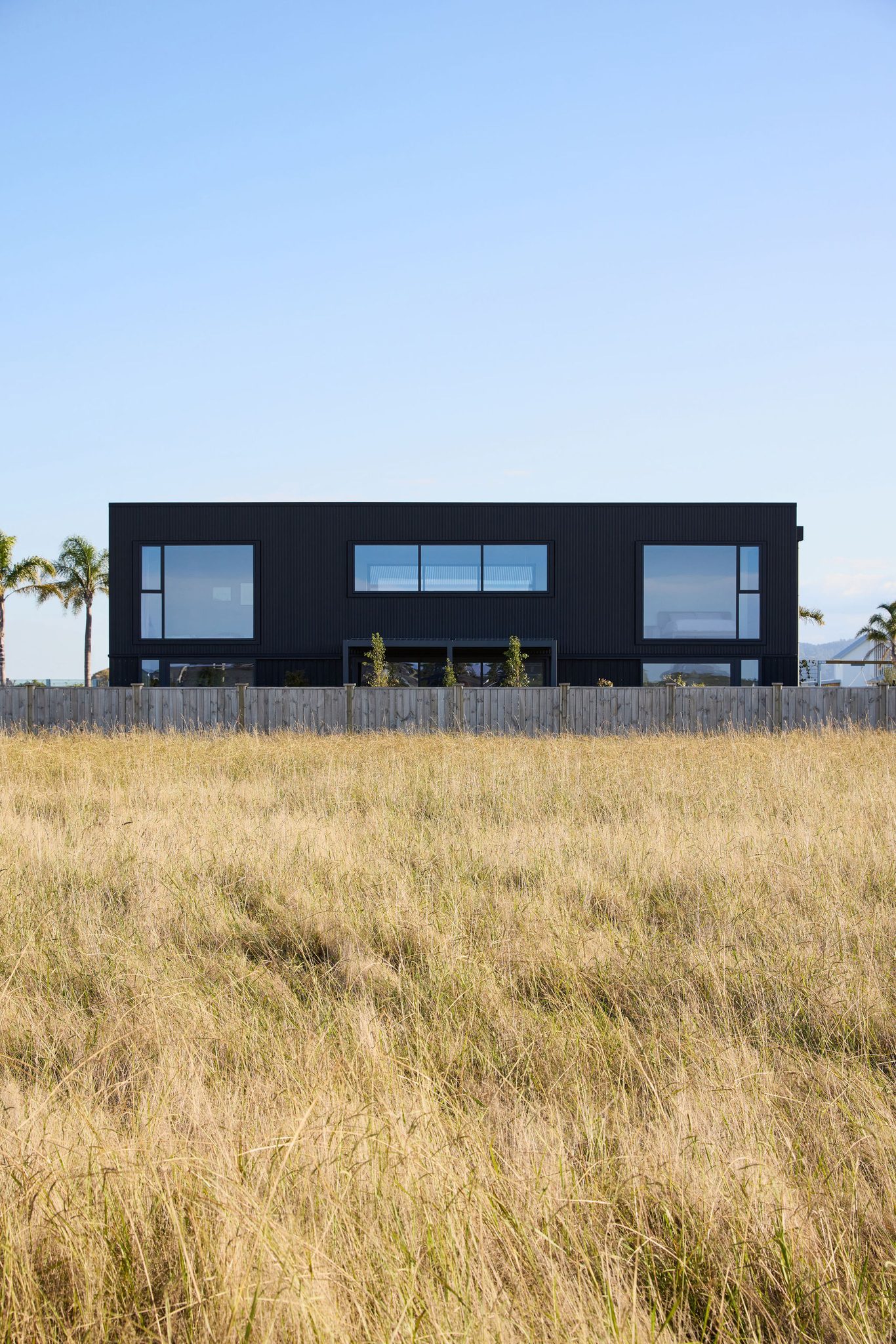 North elevation at sunset with golden grass in the foreground