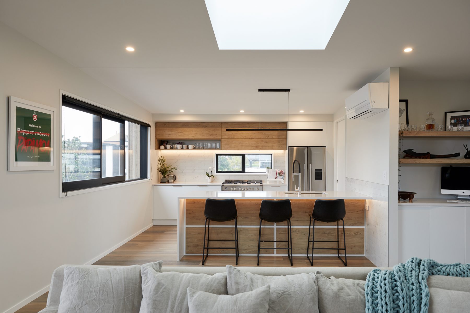 Open living spaces in white and timber.