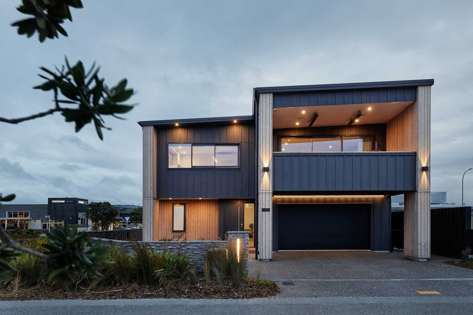 Evening: the entrance and garage front.