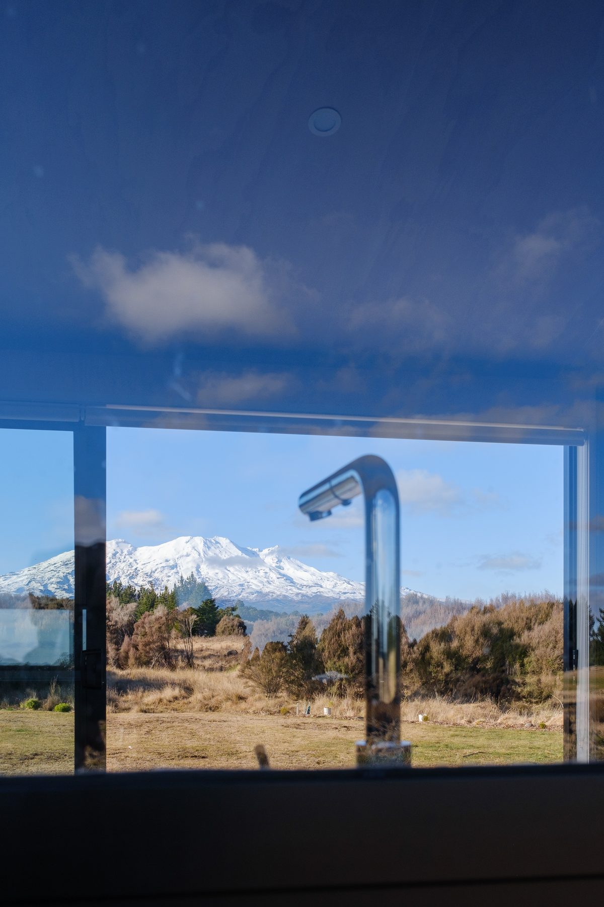 Outdoor shower against the corrugate.