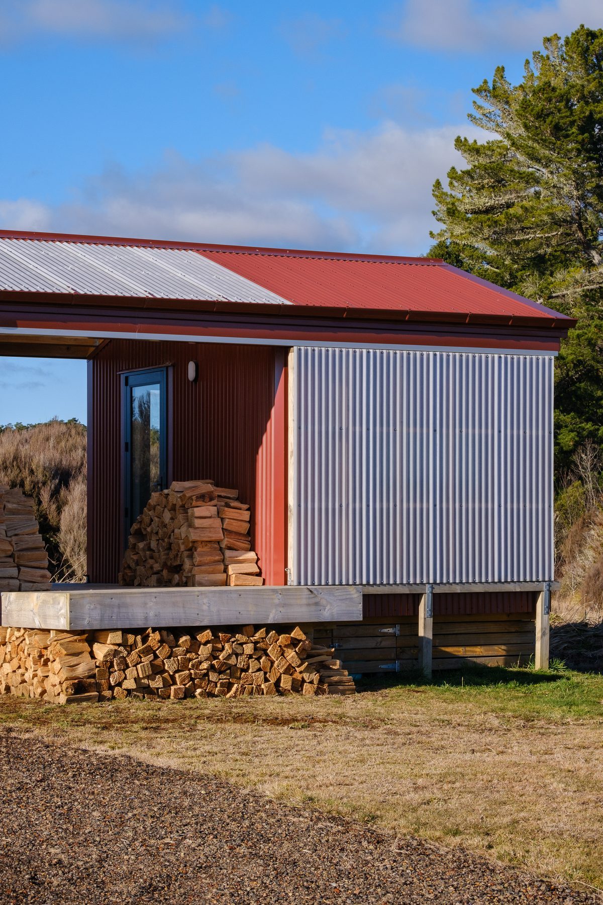 The firewood store at the gable end.