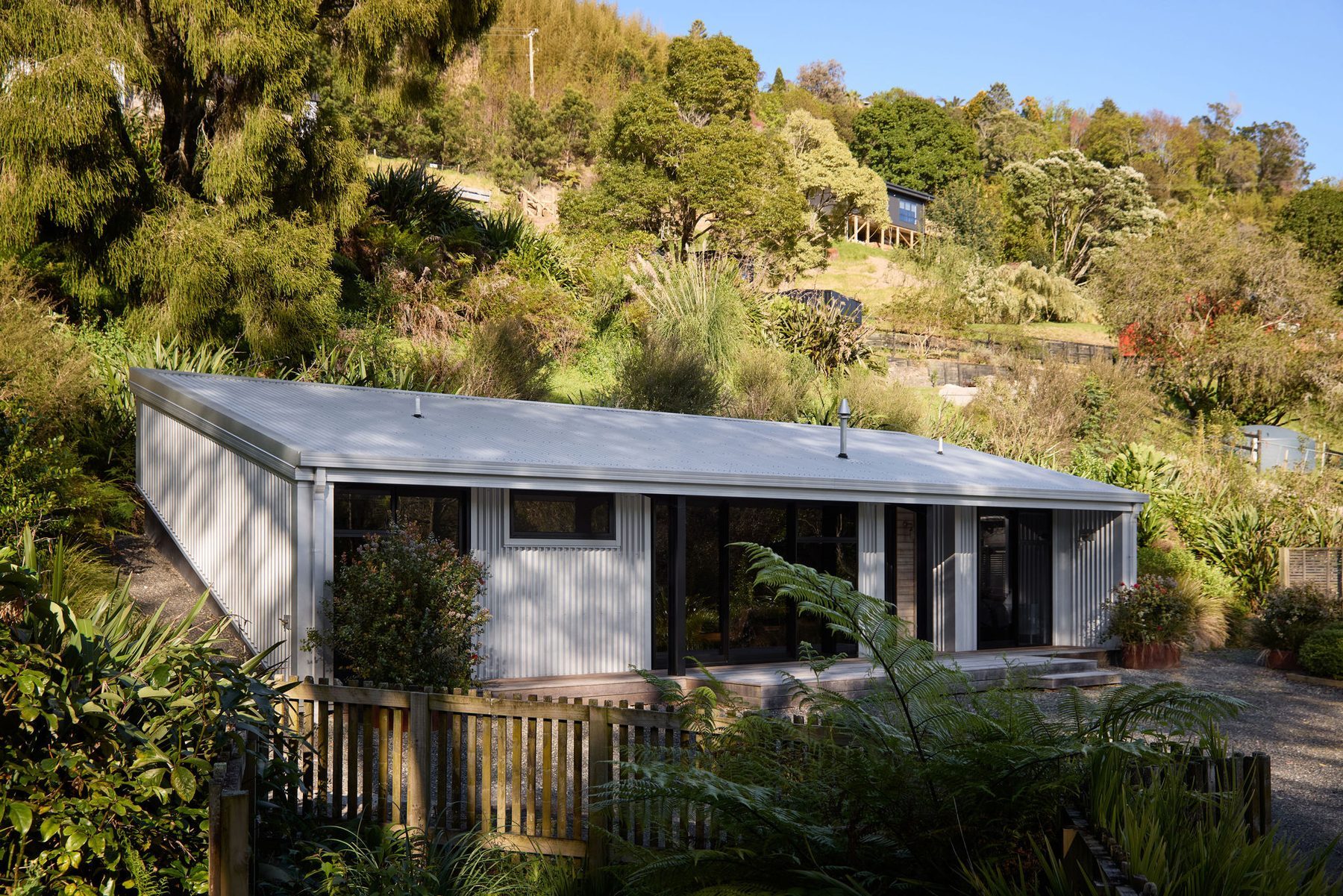The shed settled into the Te Puna hillside.