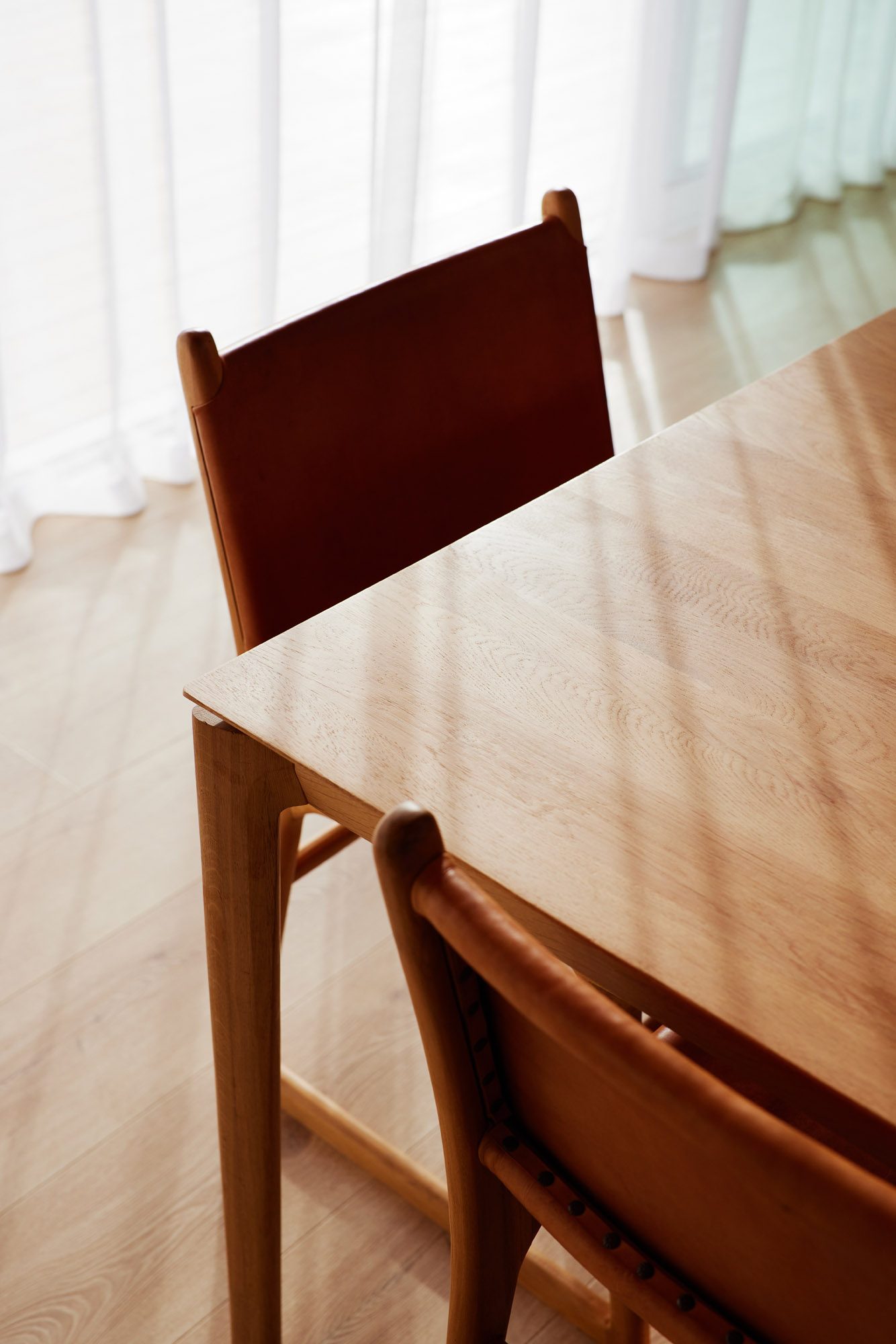 Citta dining table and chairs with soft lighting